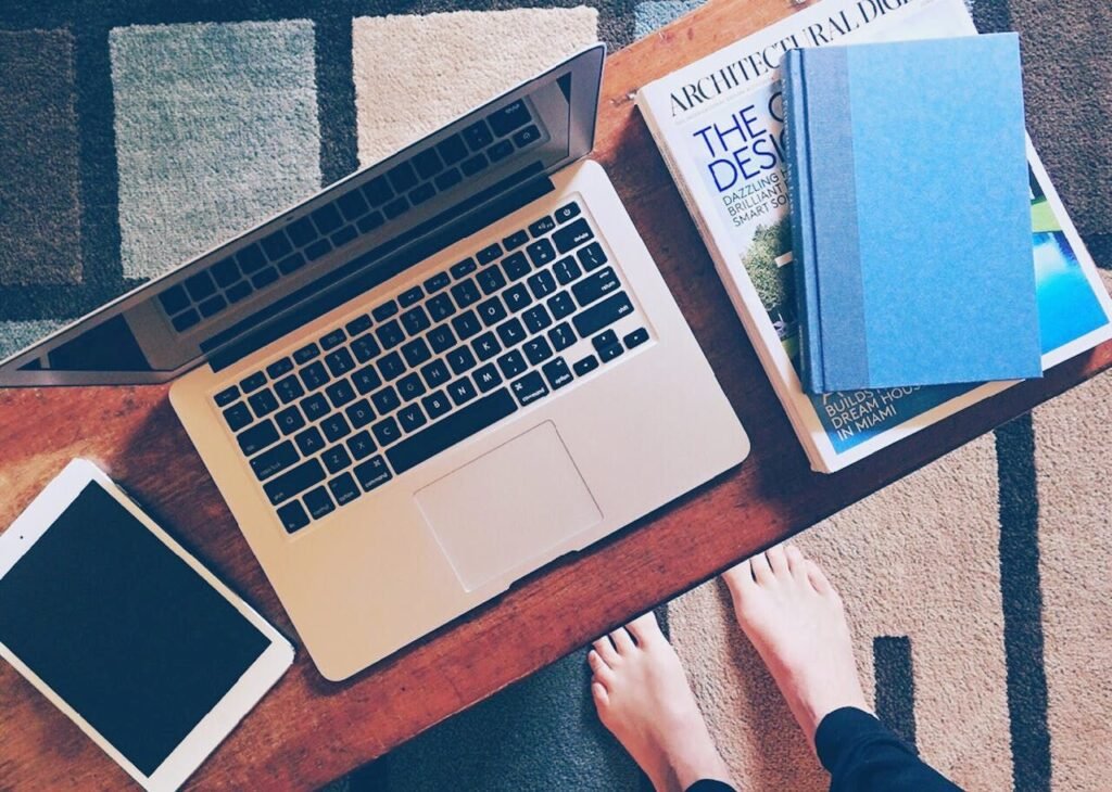 Laptop and books on working desk
