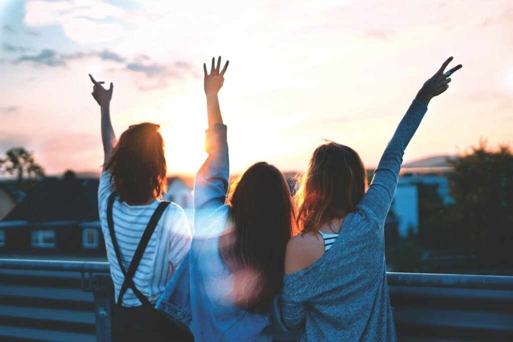Unlock Your Mind: Best Tips to Increase Mental Power, Abilities & Health 6 Three happy girls watching the sunset