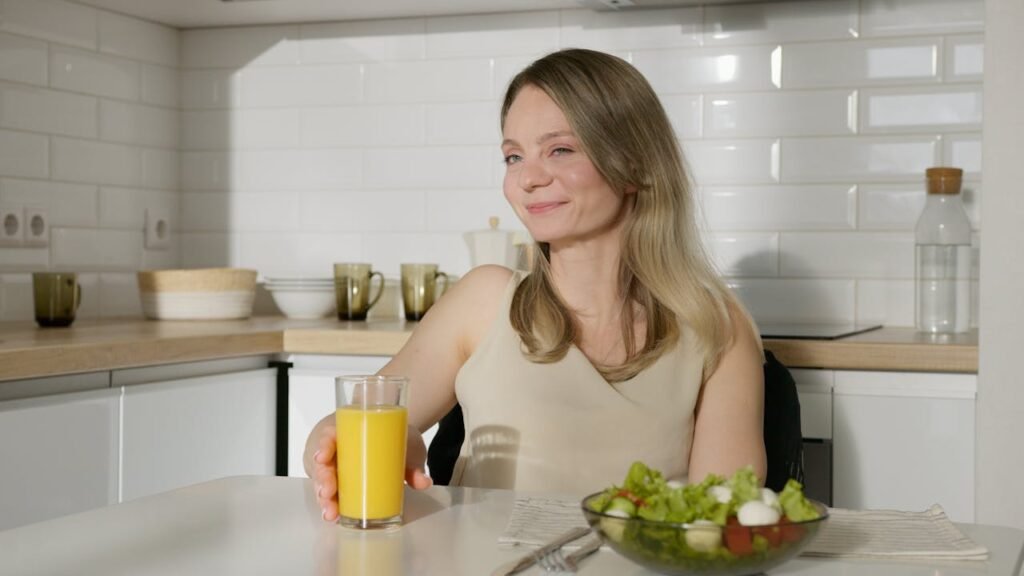 A smiling woman with healthy breakfast